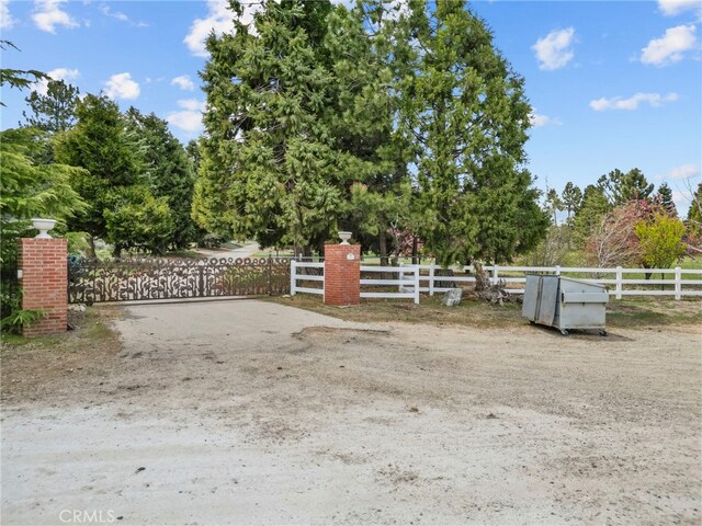 view of gate with fence