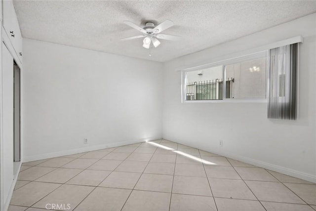 120 Alamitos Ave Unit 10, Long Beach, CA 90802 - spare room with light tile patterned floors, baseboards, a ceiling fan, and a textured ceiling