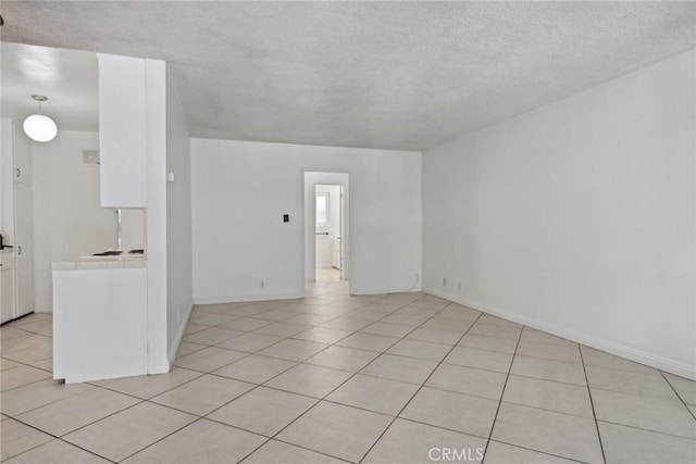 120 Alamitos Ave Unit 10, Long Beach, CA 90802 - empty room with light tile patterned floors, baseboards, and a textured ceiling