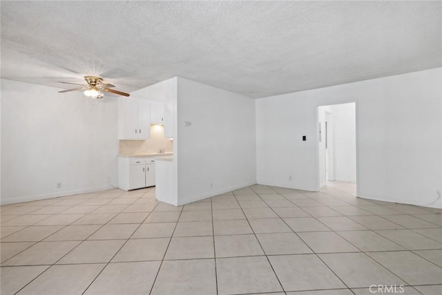 120 Alamitos Ave Unit 10, Long Beach, CA 90802 - spare room with light tile patterned floors, ceiling fan, and a textured ceiling