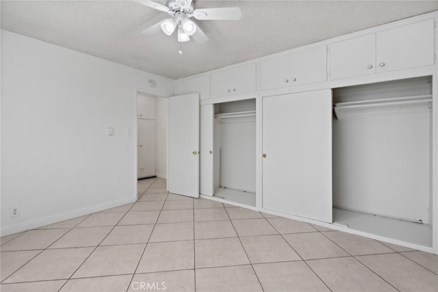120 Alamitos Ave Unit 10, Long Beach, CA 90802 - unfurnished bedroom with ceiling fan, a textured ceiling, multiple closets, and light tile patterned floors