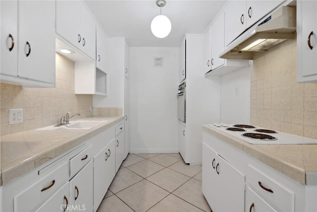 120 Alamitos Ave Unit 10, Long Beach, CA 90802 - kitchen featuring decorative backsplash, oven, under cabinet range hood, a sink, and white electric cooktop