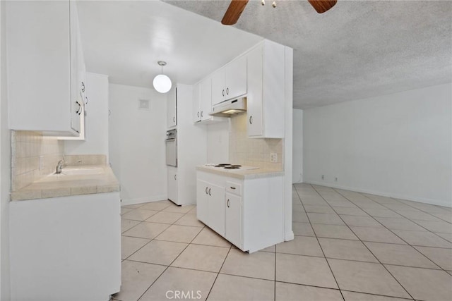 120 Alamitos Ave Unit 10, Long Beach, CA 90802 - kitchen with light countertops, a ceiling fan, wall oven, and light tile patterned flooring