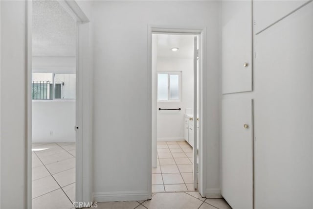 120 Alamitos Ave Unit 10, Long Beach, CA 90802 - corridor featuring baseboards and light tile patterned flooring