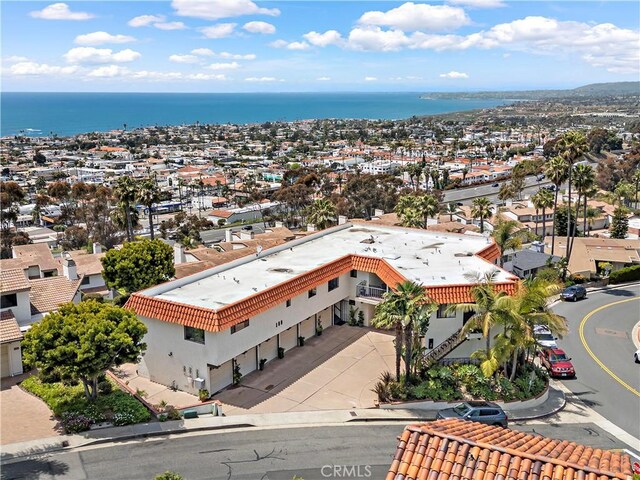 bird's eye view featuring a water view and a residential view