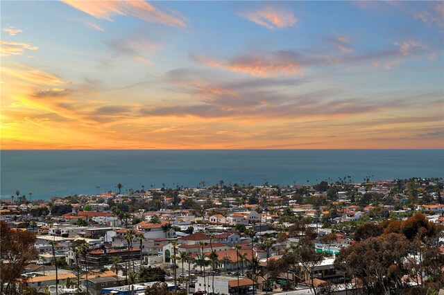 aerial view at dusk with a water view