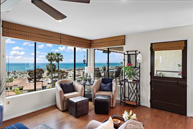 100 Calle Patricia Unit 1A, San Clemente, CA 92672 - sunroom / solarium with wood finished floors, a water view, and baseboards