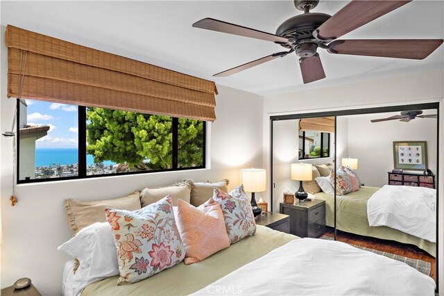 bedroom featuring a closet and a ceiling fan