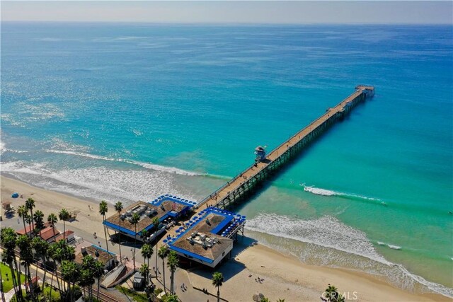 bird's eye view with a beach view and a water view