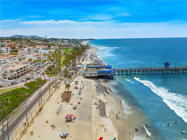aerial view with a view of the beach and a water view