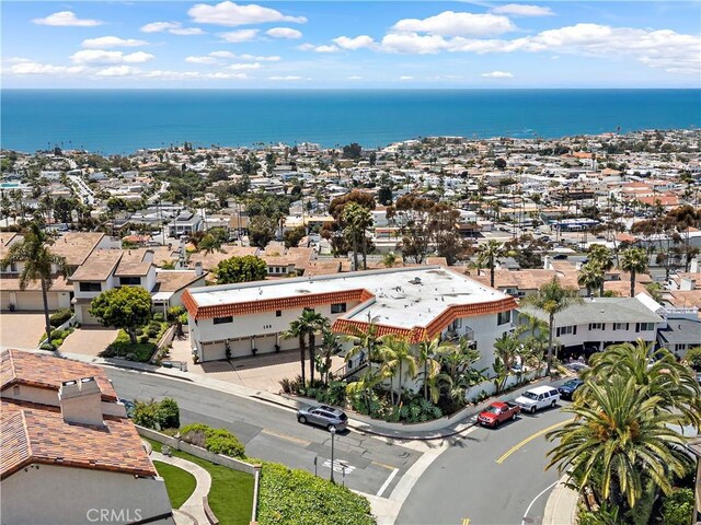 bird's eye view featuring a water view and a residential view