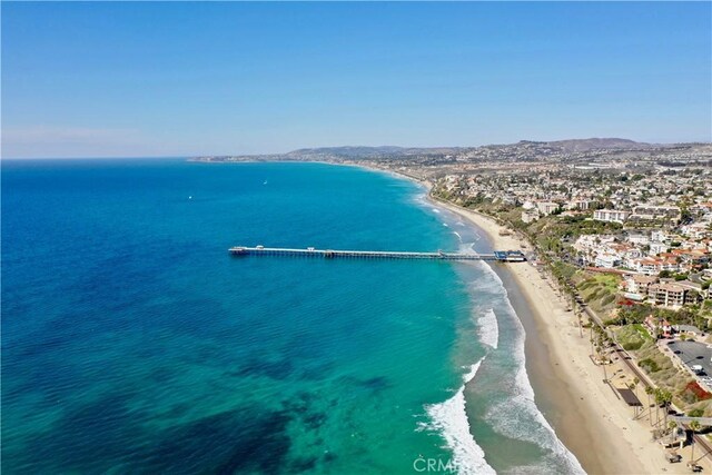 birds eye view of property featuring a beach view and a water and mountain view