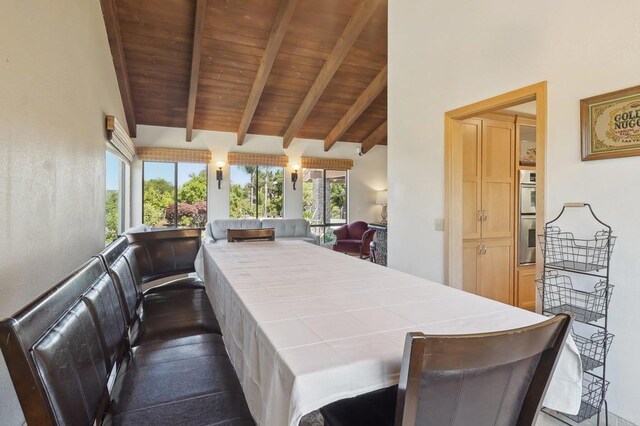 exterior space featuring wooden ceiling and vaulted ceiling with beams