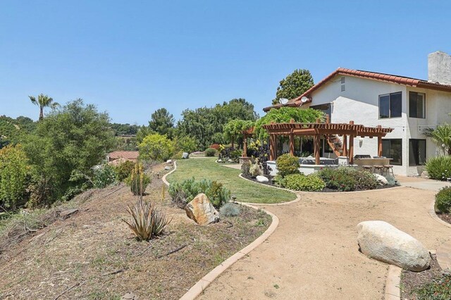 view of yard featuring a pergola and a patio
