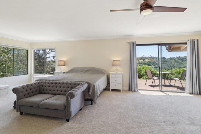 bedroom with crown molding, a ceiling fan, light carpet, and access to exterior