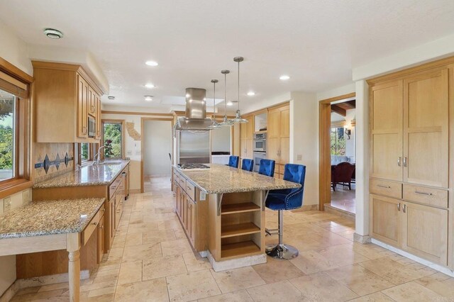 kitchen featuring light brown cabinetry, recessed lighting, open shelves, and island exhaust hood