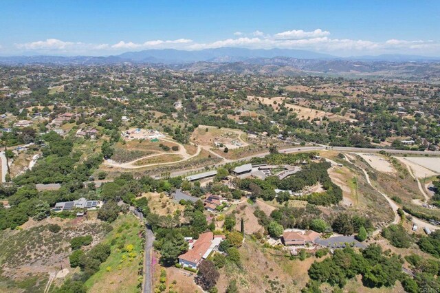 drone / aerial view featuring a mountain view