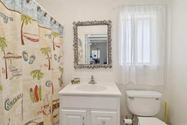 bathroom with vanity and toilet