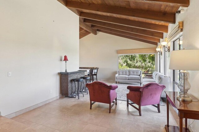 tiled living area featuring vaulted ceiling with beams, baseboards, and wood ceiling