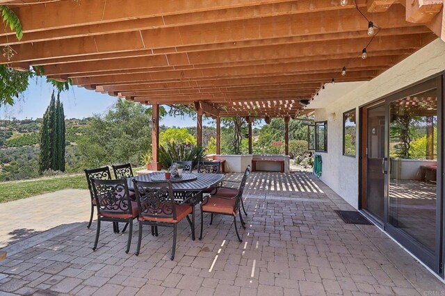 view of patio featuring outdoor dining area