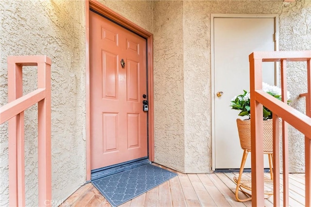 doorway to property with stucco siding