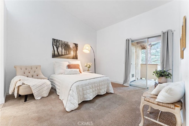 carpeted bedroom featuring baseboards, access to outside, and vaulted ceiling