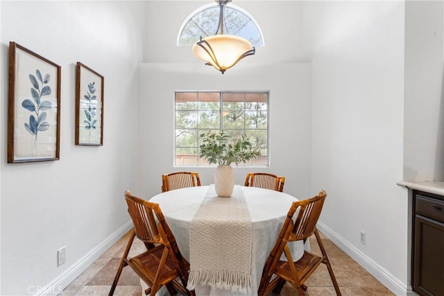 dining space with a healthy amount of sunlight and baseboards