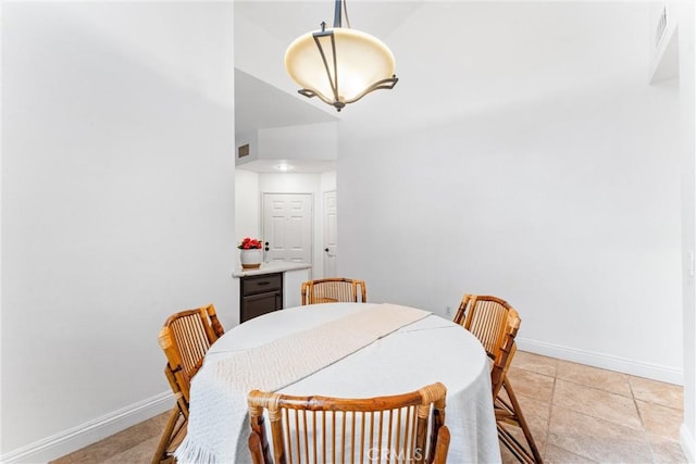 dining room featuring baseboards and visible vents