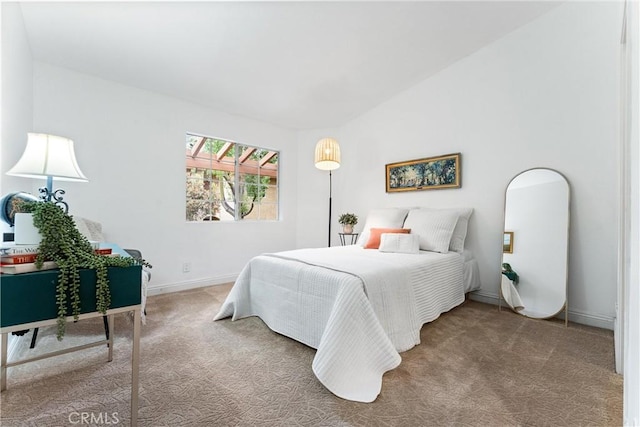 bedroom with carpet floors and baseboards