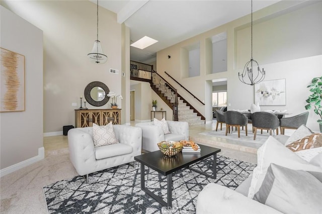 24661 Las Patranas, Yorba Linda, CA 92887 - carpeted living room with visible vents, high vaulted ceiling, baseboards, a chandelier, and stairs