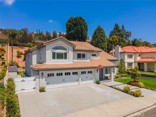 24661 Las Patranas, Yorba Linda, CA 92887 - traditional-style home with a garage, a gate, a tile roof, and concrete driveway