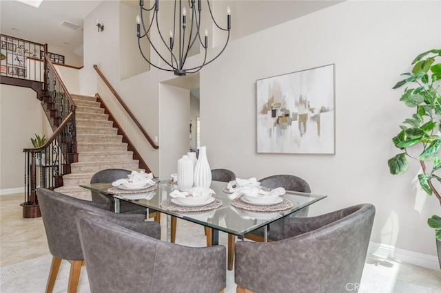 24661 Las Patranas, Yorba Linda, CA 92887 - dining area featuring an inviting chandelier, baseboards, a towering ceiling, and stairway