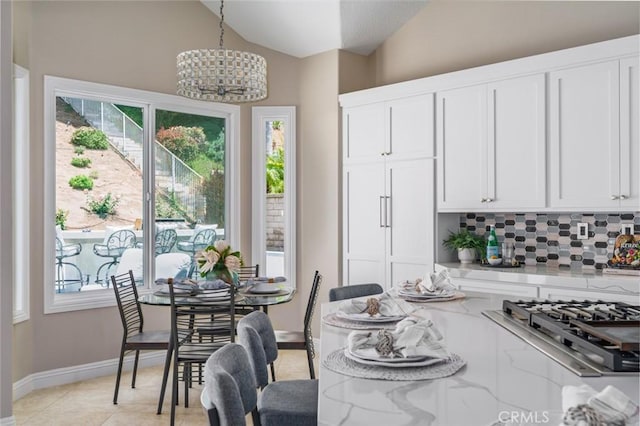 24661 Las Patranas, Yorba Linda, CA 92887 - dining room with baseboards, light tile patterned floors, lofted ceiling, and a notable chandelier