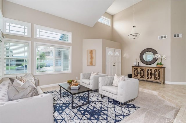 24661 Las Patranas, Yorba Linda, CA 92887 - living room with visible vents, baseboards, and a high ceiling