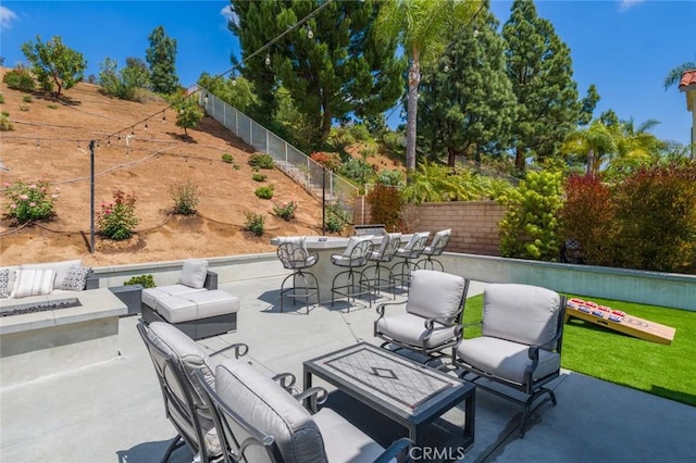 24661 Las Patranas, Yorba Linda, CA 92887 - view of patio / terrace with a fenced backyard, an outdoor living space with a fire pit, and outdoor dry bar