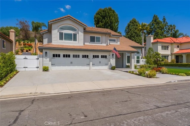 24661 Las Patranas, Yorba Linda, CA 92887 - traditional-style house featuring fence, an attached garage, a gate, concrete driveway, and a tiled roof