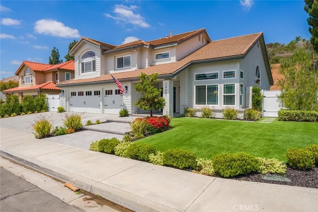 24661 Las Patranas, Yorba Linda, CA 92887 - view of front of house with a tile roof, fence, a front lawn, concrete driveway, and an attached garage