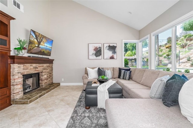 24661 Las Patranas, Yorba Linda, CA 92887 - living room featuring a stone fireplace, visible vents, light tile patterned floors, high vaulted ceiling, and baseboards