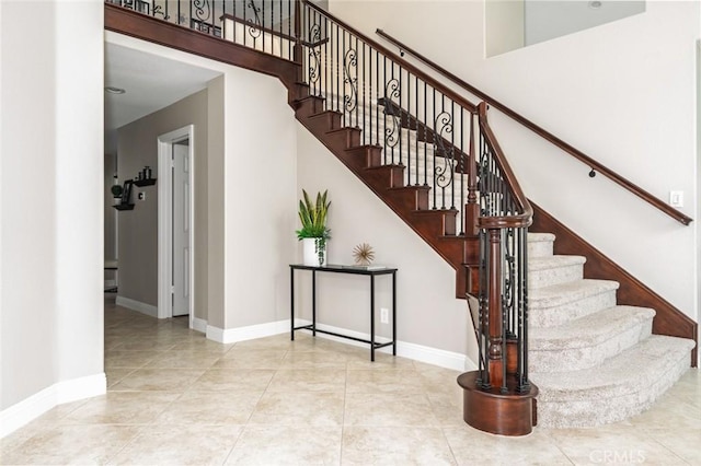 24661 Las Patranas, Yorba Linda, CA 92887 - stairway with baseboards and tile patterned floors