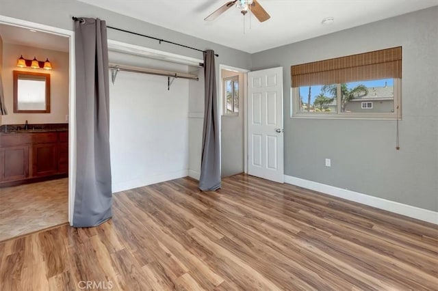 34605 Calle Portola, Dana Point, CA 92624 - unfurnished bedroom with a sink, baseboards, ensuite bathroom, and light wood-style flooring