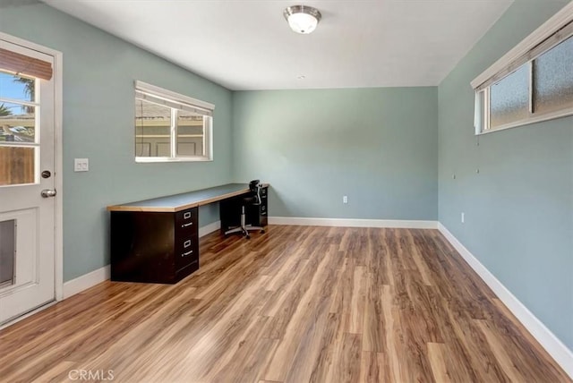 34605 Calle Portola, Dana Point, CA 92624 - unfurnished office featuring baseboards, plenty of natural light, and wood finished floors