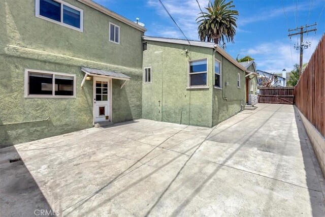 34605 Calle Portola, Dana Point, CA 92624 - rear view of property with a patio area, stucco siding, and fence