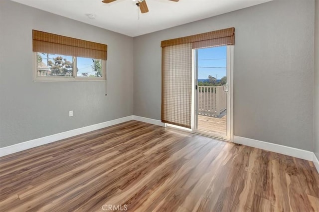 34605 Calle Portola, Dana Point, CA 92624 - empty room with baseboards, a ceiling fan, wood finished floors, and a healthy amount of sunlight
