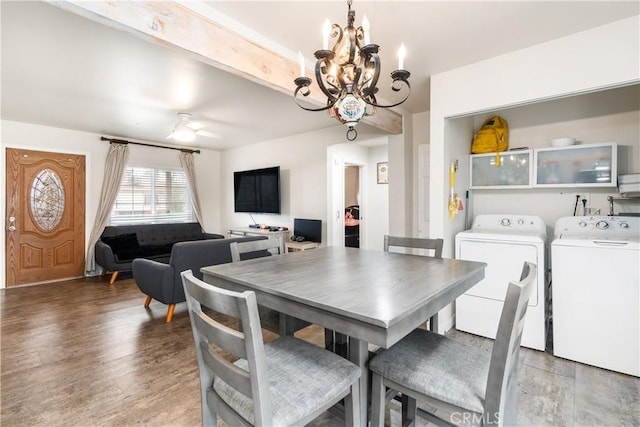 dining room with light wood finished floors, independent washer and dryer, and ceiling fan with notable chandelier