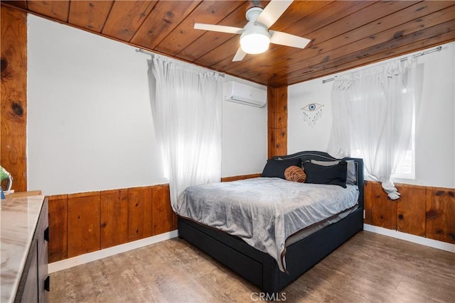 bedroom featuring a wall mounted air conditioner, wood ceiling, and light wood finished floors