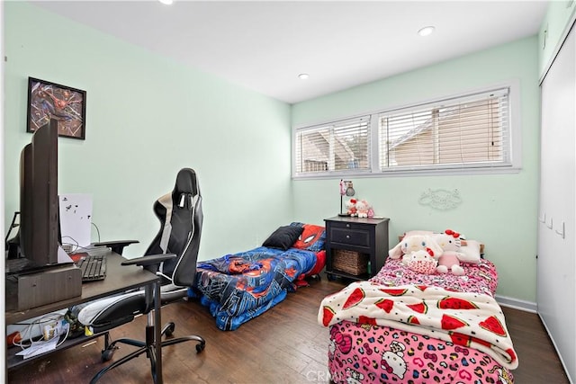 bedroom featuring recessed lighting and wood finished floors