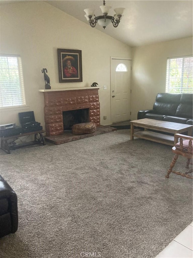 2235 Willow Rd, Arroyo Grande, CA 93420 - living room featuring vaulted ceiling, a brick fireplace, a chandelier, and carpet
