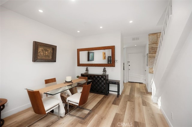 dining area featuring recessed lighting, light wood-style flooring, and visible vents