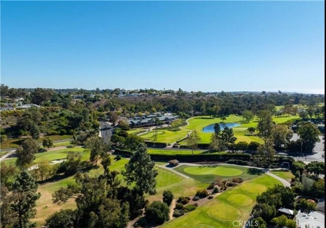 bird's eye view featuring a water view and golf course view