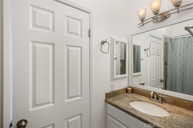 bathroom with vanity and a shower with curtain